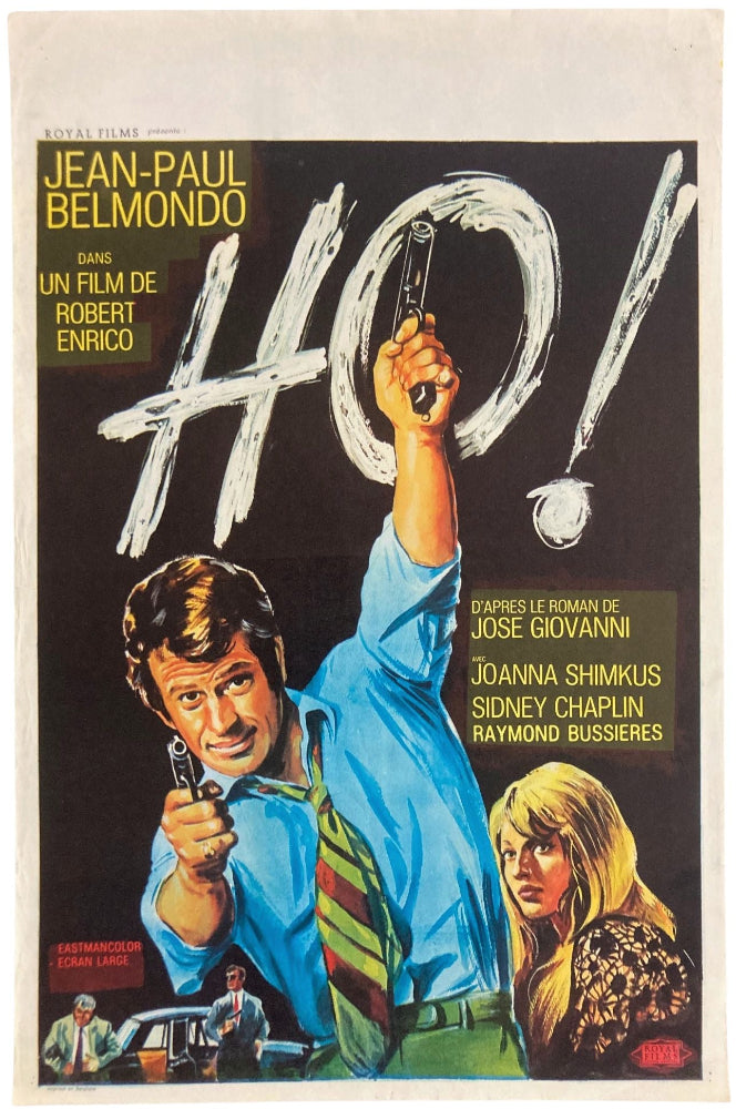 jean paul belmondo in green tie and two guns