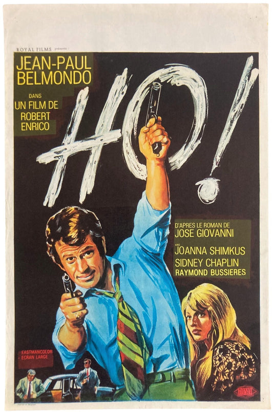 jean paul belmondo in green tie and two guns
